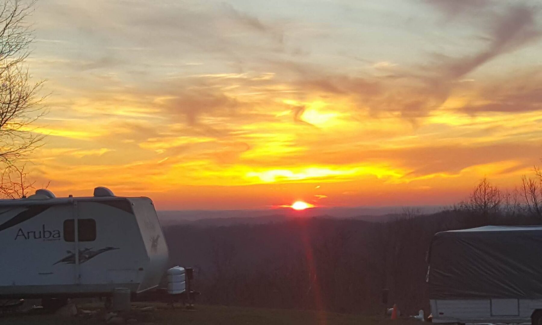 Sunset over the valley behind an RV at the resort