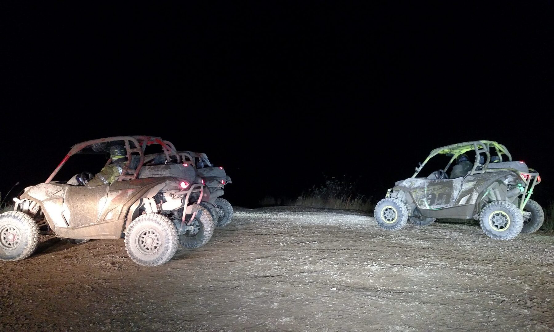 Two UTVs parked on the mountain at night